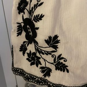 White linen J. Crew shorts with embroidery on the front. Size 2.